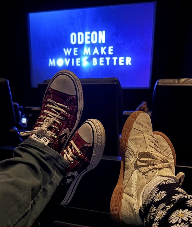 Picture of feet on recliner chairs at cinema